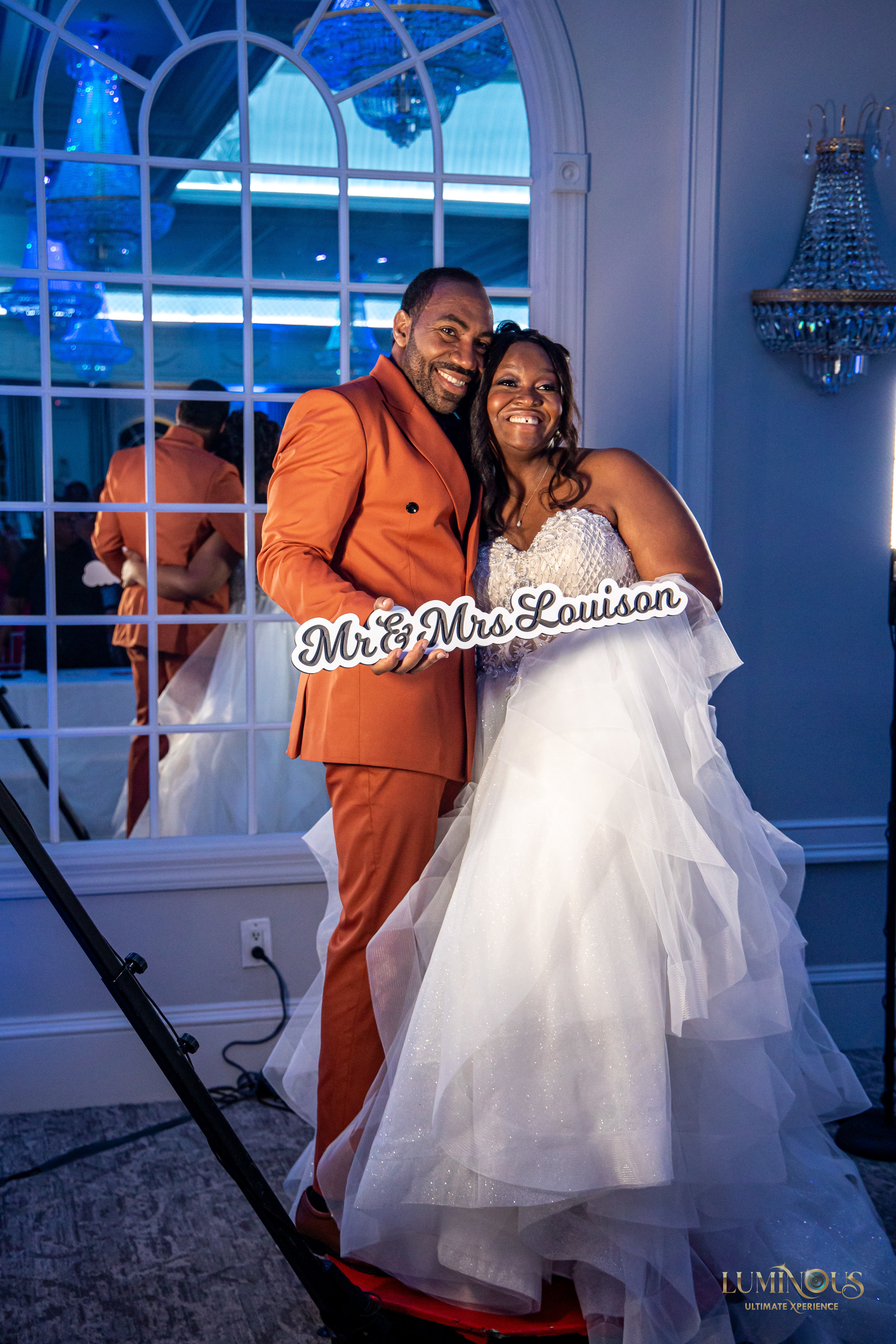 The beautiful bride and groom enjoying having photos taken at their wedding by the 360